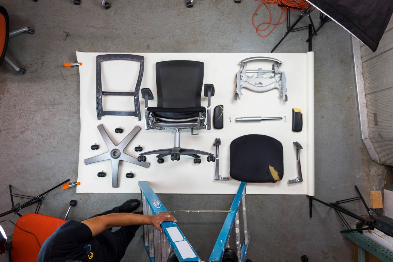 Disassembled used ergonomic office chair laid out for refurbishing at EChairs Global in New York